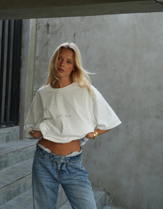Made from 100% cotton in crisp white fabric, The Latte Tee is your go-to everyday staple. Featuring a unisex oversized fit, it’s soft, breathable, and effortlessly versatile. Perfect for layering or wearing on its own, this tee delivers comfort and style in equal measure.

