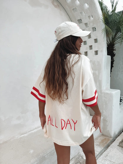 The Rosè All Day Tee - featuring a cream coloured base, ribbing on the sleeves, front print and back print.
