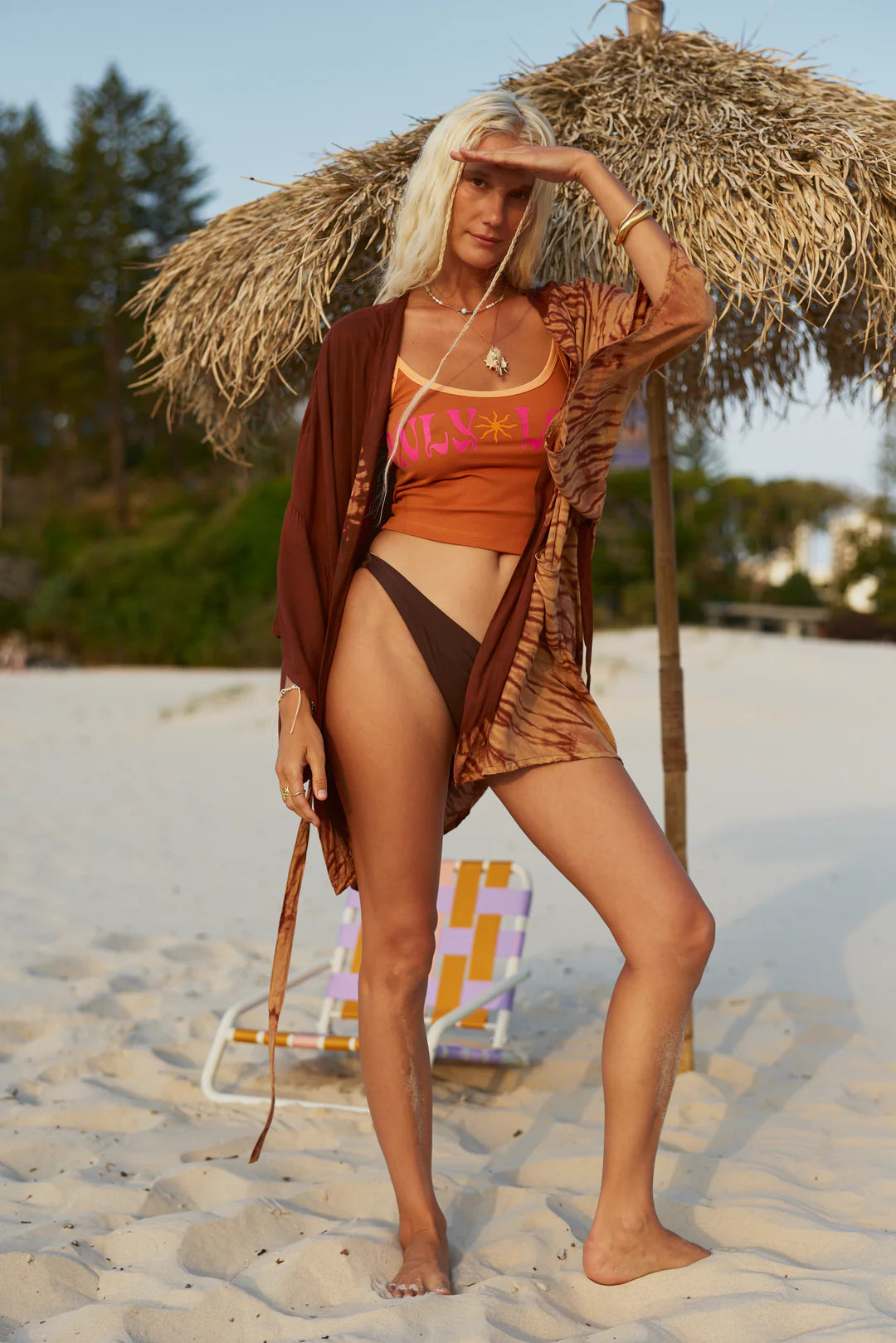 Only Lovers Left - Sun on your skin. Balmy days ahead.

Crafted from a soft ribbed cotton–spandex blend, it’s stretchy yet structured, hugging in all the right places. Designed with a flattering low neckline, open back, and contrast trim, it’s finished with a punchy front print and a cute little sun motif that brings the Seashell Motel energy full circle.


Pairs perfectly with our Shell Club Boxer Shorts for a spicy, sun-soaked look.