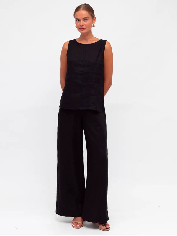 Stay cool and chic in this sleeveless tank. With a crew neckline, zipper in the back, and side splits, it's as functional as it is stylish. And did we mention it's made of luxurious linen fabric? You'll look and feel your best in the Linen Luxe Tank - Black