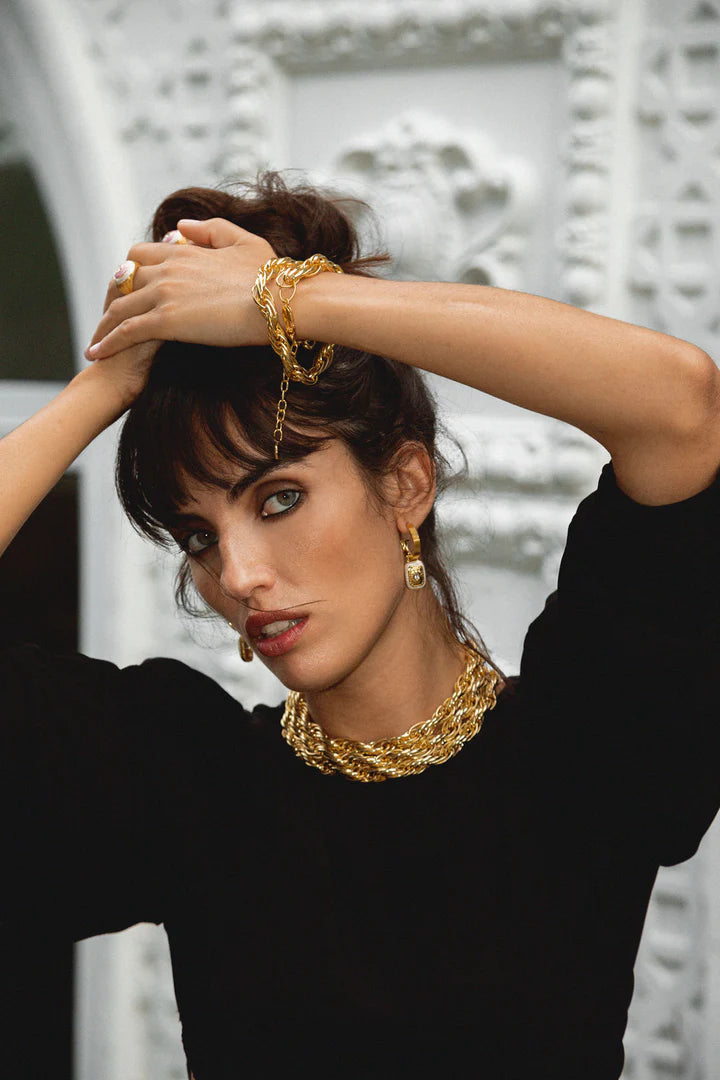 The&nbsp;Mara's are the epitome of classic style with a fabulous yet playful twist.&nbsp;They're beautiful, chic, and oh-so sassy… Crafted on a chunky fluted hoop, they feature a unique rectangle motif drop, combine with hammered gold texture,&nbsp;pearlescent enamel&nbsp;and eye-catching&nbsp;faceted Crystal Quartz&nbsp;gemstones. The Mara Earrings&nbsp;can be worn from day to night, with dazzling yet sophisticated flair that’s sure to turn heads. Enjoy the perfect balance of classic yet flirty with these 
