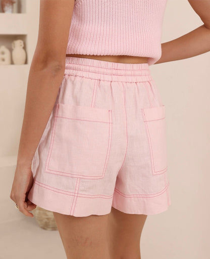 Olivia Pink Shorts I Iris Maxi

Dare to stand out in these Pink Shorts, where comfort meets bold style. Crafted from a breathable ramie and cotton blend, they feature a flattering mid-thigh cut that moves with you. The striking feature hem stitch adds an unexpected edge, while the adjustable drawstring waist ensures a perfect fit every time. Light pink perfection with attitude.