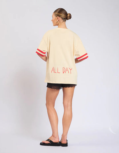 Easy, playful, and made for weekends — the Rosè All Day Tee is your go-to for relaxed styling with a touch of fun.

With its soft cream base, this tee is elevated by ribbed sleeve details that add structure, while the statement front and back prints bring personality from every angle. Designed in a relaxed fit, it’s the perfect throw-on-and-go piece that still feels effortlessly put together.