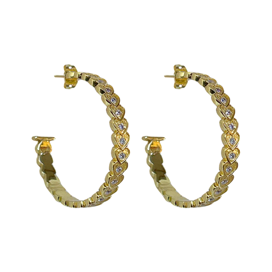 She's fun, she's flirty, she's fabulous... the AMBER Hoops! The iconic and head-turning hoops with a sassy textured heart motif and sparkling CZ.&nbsp;Talk about eye catching&nbsp;and sure to add a playful touch to any look, the Amber hoops will be your go-to accessory. Who doesn’t love a hoop... but make it iconic!