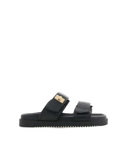 Amylee is a luxe summer slide, available exclusively to Billini.

Get holiday ready with this luxe &amp; easy to wear slide.

Featuring;

flat footbed with chunky exposed sole
open round toe
thick twin strap on upper with adjustable velcro straps
faux buckle on strap in gold hardware detailing
open heel counter
synthetic upper, lining and outsole