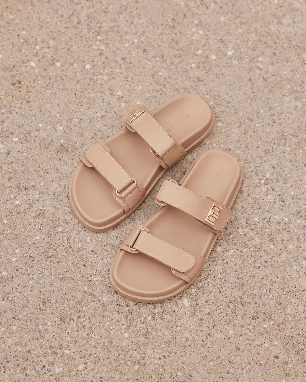 Amylee is a luxe summer slide, available exclusively to Billini.

Get holiday ready with this luxe & easy to wear slide.

Featuring;

flat footbed with chunky exposed sole
open round toe
thick twin strap on upper with adjustable velcro straps
faux buckle on strap in gold hardware detailing
open heel counter
synthetic upper, lining and outsole