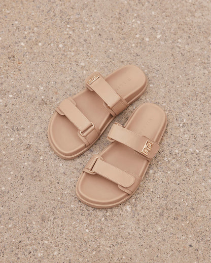 Amylee is a luxe summer slide, available exclusively to Billini.

Get holiday ready with this luxe & easy to wear slide.

Featuring;

flat footbed with chunky exposed sole
open round toe
thick twin strap on upper with adjustable velcro straps
faux buckle on strap in gold hardware detailing
open heel counter
synthetic upper, lining and outsole