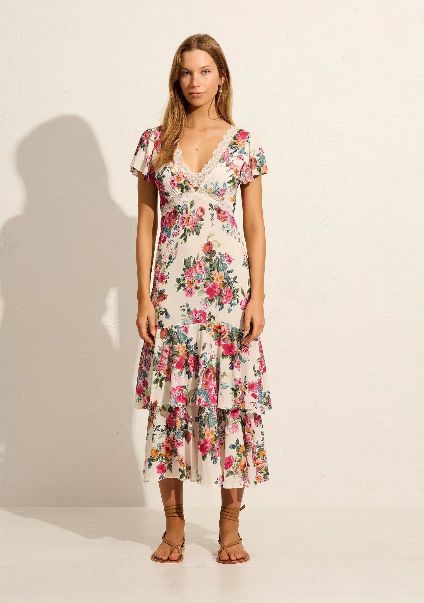 The Allison Midi Dress by Auguste the label in our vintage-inspired Iris floral has you ready for any event. It features a flattering V-neckline with a lace insert and subtle cut-out details at the center front and under bust, feminine short flutter sleeves, and a bias-cut silhouette that gracefully drapes to the shape of your body.