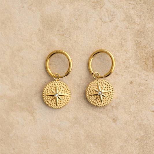 Add some charm to your look with the AVA earrings. Guaranteed to make you stand out and sparkle from the crowd. Shine bright with AVA!

S925 Gold Plated Sterling Silver
Cubic Zirconia/Star Charmed
Lead,Nickel &amp; Tarnish Free
Hypoallergenic
Measures 2.5cm in Length