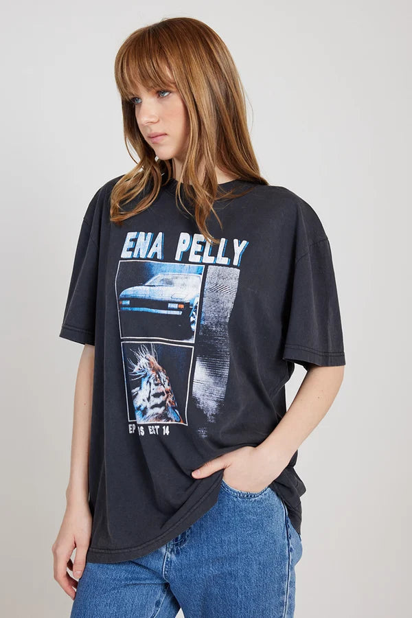 The Fast Lane Oversized Tee from Ena Pelly has been designed to be the ultimate vintage-inspired tee for your wardrobe. Crafted from a recycled cotton blend, the tee has been designed to be an oversized fit. The graphic is inspired by 80s motifs featuring a bold pop of cobalt blue.