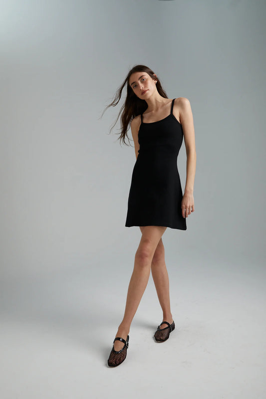 The infamous Summi A-line is back! Cut from form flattering ribbed cotton in limitless black, this simple dress is every gals dream!