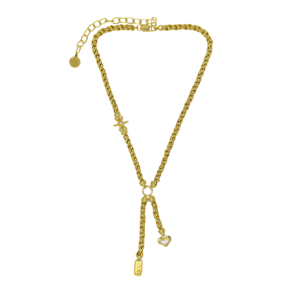 Playful yet powerful, the Cassia Necklace is a bold expression of modern mythology. Designed in a lariat style with a textured, rope-like gold chain, this statement piece features three symbolic charms—star, heart, and dog tag—each suspended at asymmetrical lengths and detailed with pearl enamel accents.