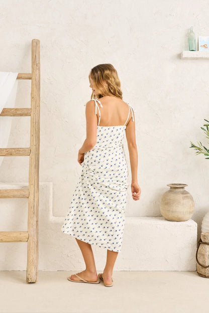 Printed in a vintage-inspired floral, this midi dress is cut on the bias for a soft drape. Finished with scalloped lace trim and tie straps for a subtle romantic edge.