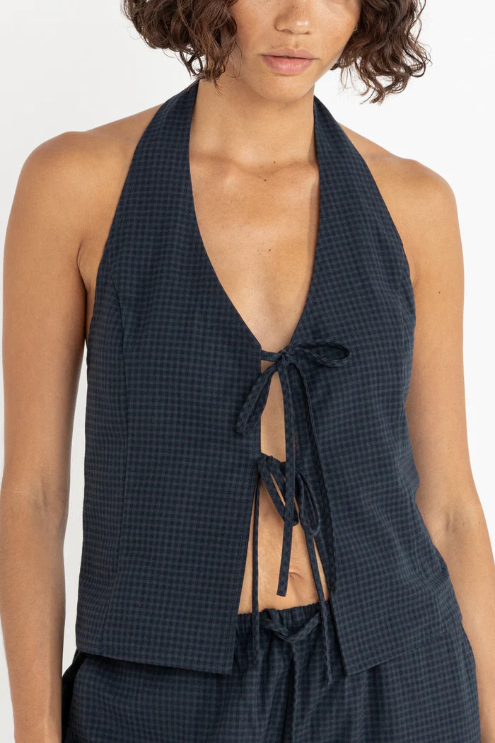 Add a nautical touch to your wardrobe with the Louise Check Halter Top in Navy. Featuring front ties and a smocked back, this piece is perfect for warm days by the water.