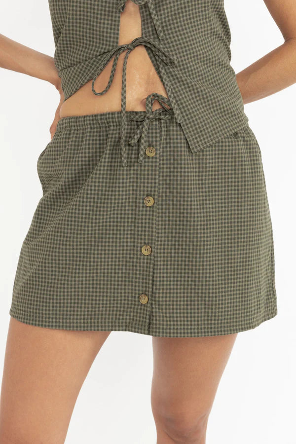 Louise Check Skort – Olive

The Louise Check Skort is where comfort meets effortless style. Designed with the ease of shorts and the chic look of a skirt, this versatile piece is crafted in a timeless olive check pattern that elevates everyday dressing.