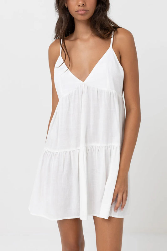 Made for breezy summer days poolside under the warm sun, the Classic Tiered Mini Dress is cut in a textured rayon linen blend. Featuring an effortless single tiered mini flow and flattering deep V neck, the Classic Tiered Mini Dress is a foundational wardrobe essential.
