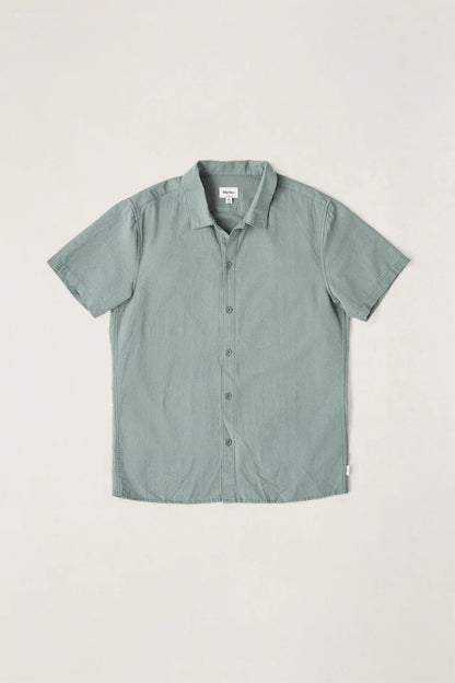 The Classic Linen SS Shirt in Silver Pine is a wardrobe essential for all seasons. Made from lightweight, breathable linen, this short-sleeve shirt is perfect for keeping cool on warm days, making it a versatile piece for any coastal adventure