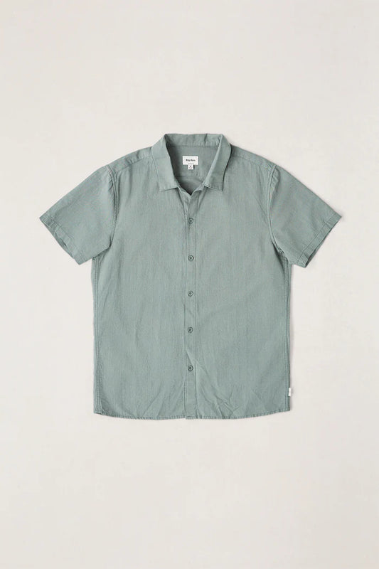 The Classic Linen SS Shirt in Silver Pine is a wardrobe essential for all seasons. Made from lightweight, breathable linen, this short-sleeve shirt is perfect for keeping cool on warm days, making it a versatile piece for any coastal adventure