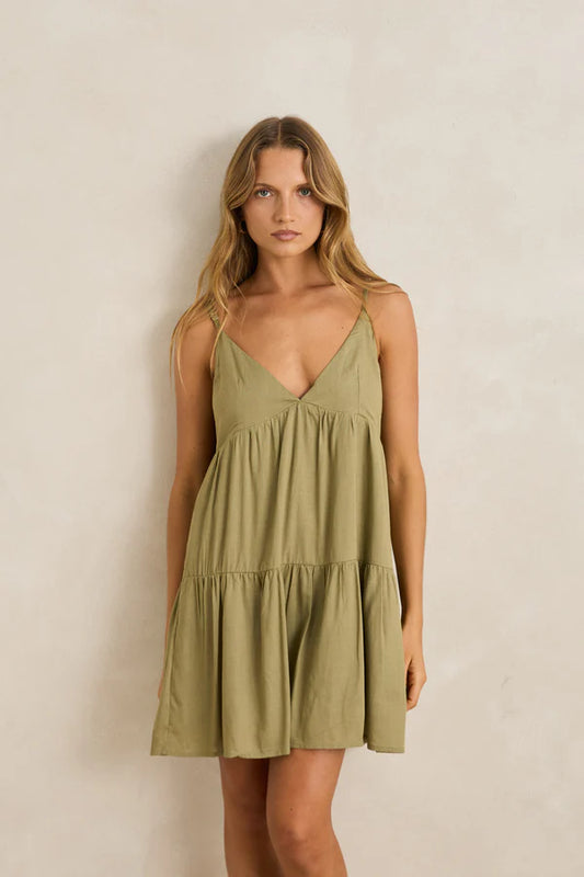 With a fitted bodice, deep V neckline and full sweeping hemline, the Classic Tiered Mini Dress is sure to make a statement. Delivering an elegant coastal design that can be worn between dinner dates, and beach walks both.
