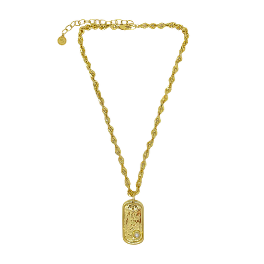 Bold yet refined, the Cypress Necklace is a statement of strength, elegance, and coastal allure. Featuring a thick, twisted gold chain with sculptural detailing, it’s anchored by a modern pendant inspired by the classic dog tag—reimagined with softened edges and elevated design. At its heart sits a luminous freshwater pearl, evoking the calm power of the sea.