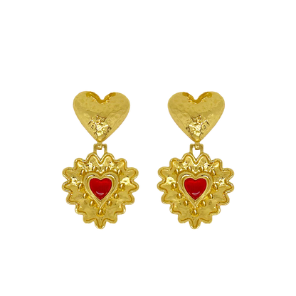 Introducing the divine Cordelia Earrings. Embrace all-consuming love and channel your inner romantic protagonist wearing these beauties. The Cordelia are adorned with a double heart motif reimagined in the most iconic way.