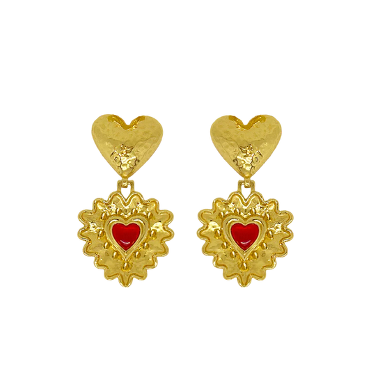 Introducing the divine Cordelia Earrings. Embrace all-consuming love and channel your inner romantic protagonist wearing these beauties. The Cordelia are adorned with a double heart motif reimagined in the most iconic way.