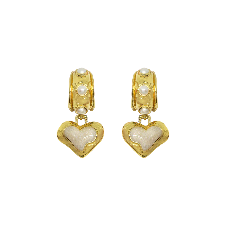 The&nbsp;Elena Earrings are a romantic nod to sun-soaked summers and ancient beauty,&nbsp;where antique ruins meet modern elegance. Featuring heart-shaped silhouettes bathed in gold, adorned with lustrous freshwater pearls and hand applied pearlescent enamel detailing.



Part of our Sirens Collection, these earrings draw from the timeless charm of the Mediterranean—where molten textures echo the ruins of antiquity, and every shimmer captures the glint of sea and sky. 