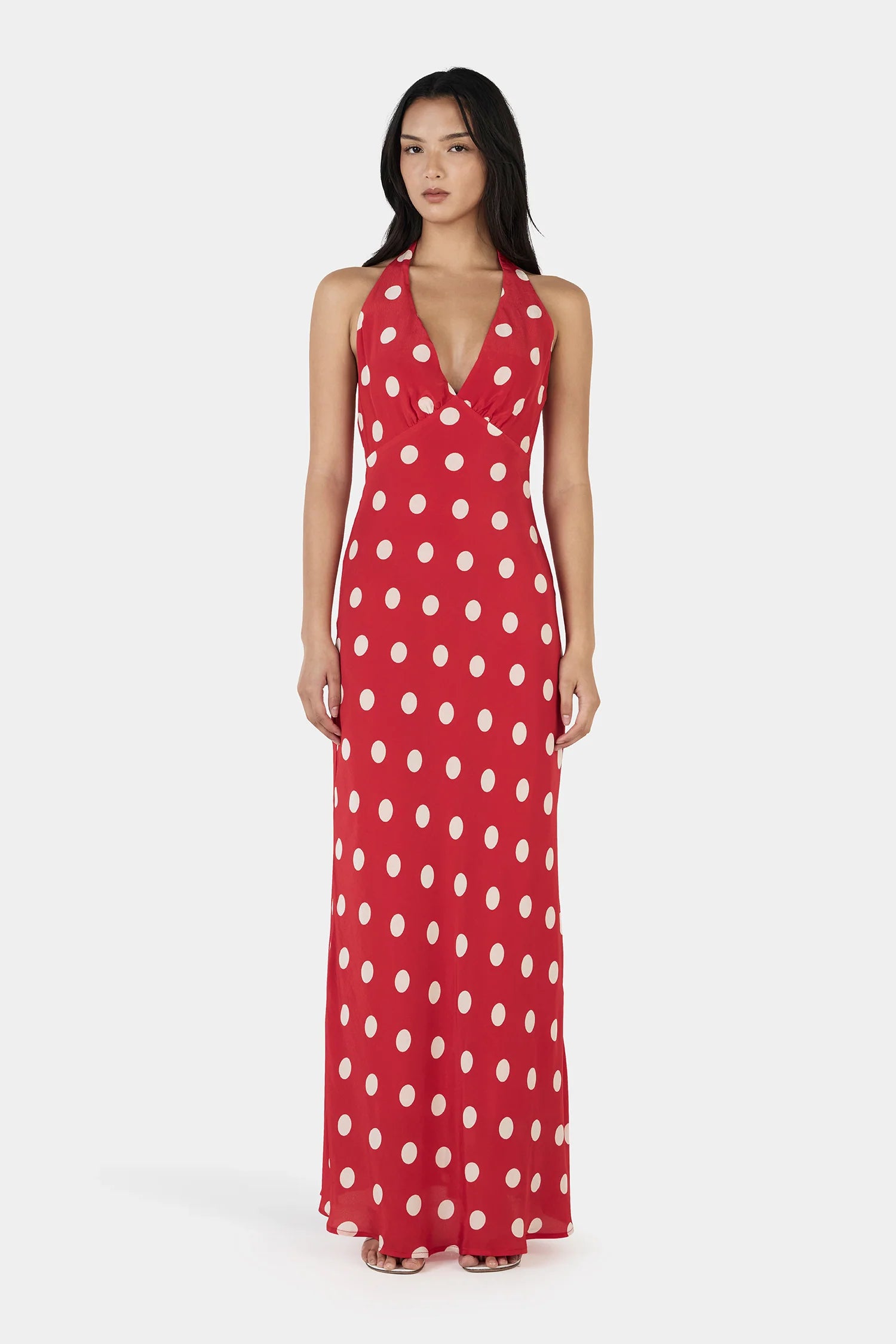 The Elyse Maxi Dress is a flattering V-neck halter maxi dress with a low scoop back and adjustable neck tie. Fully lined for a smooth silhouette and finished with a side seam zip for entry, this dress can take you anywhere.