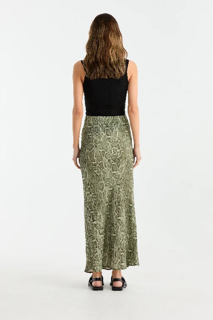 Animal-printed georgette skirt designed with a bias cut to create a graceful and flattering silhouette. Featuring a maxi length and an elasticated waistband, this pull-on style combines ease of wear with a bold, striking aesthetic.