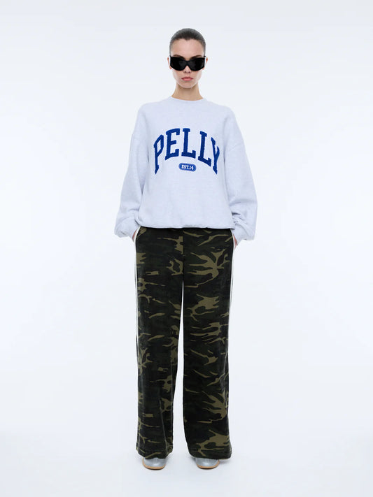 The Anniversary Sweatshirt is crafted from premium cotton terry, offering a soft yet durable texture. Featuring an oversized fit with a crew neckline, ribbed cuffs, and a ribbed neckband, it pairs comfort with elevated style. The exclusive Ena Pelly design is highlighted by a terry applique collegiate print, giving this sweatshirt its distinctive edge.