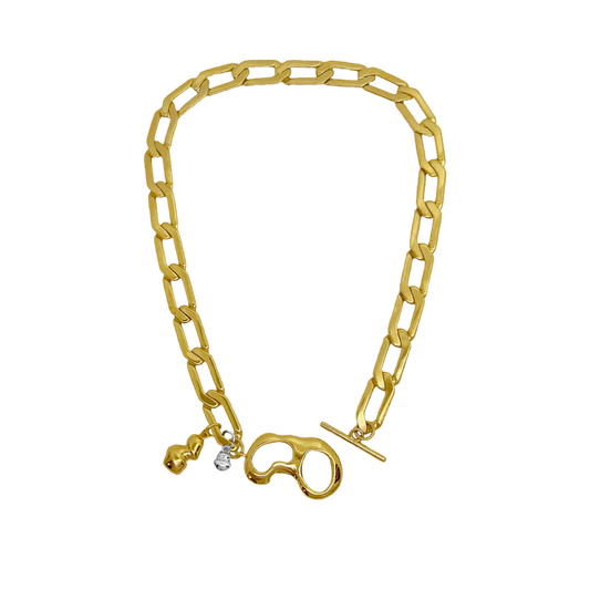 The&nbsp;EVERLEIGH&nbsp;Necklace in Gold commands attention... She exudes strength, sophistication with a hint of 'effortless cool girl' what more could we ask for!? Boasting a beautifully unique t-clasp designed around a fluid motif, adorned with droplets of mix metals, nestled between a chunky angular link chain, evoking the balance between hard and soft. Effortlessly layered or a standout all on her own. The Everleigh Necklace is that unique piece you've been searching for!