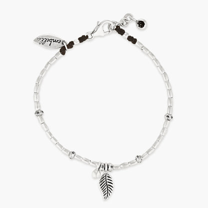 Embark on a dreamy island adventure with our Island Dreaming Anklet. Handcrafted with love, this anklet features Hilltribe Silver beads and charms that exude bohemian charm and coastal elegance. The Poly Wax cotton cord adds a touch of natural texture, while the Sterling Silver clasp and adjustable link ensure a secure and comfortable fit. Let the Island Dreaming Anklet be a reminder of carefree days and the beauty of island living.