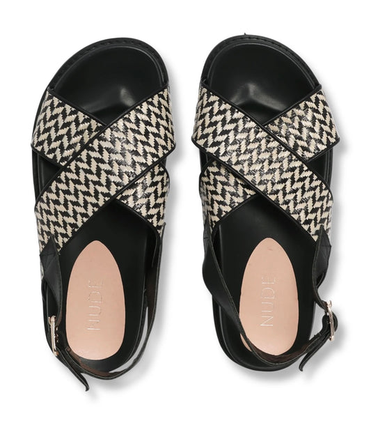 Transitioning seamlessly from casual to leisure, allow us to introduce the newest addition to our collection, the Harriett sandal. This sandal features a comfortable rubber sole, an intricate raffia-patterned upper, and an ankle strap for added support. Pair the Harriett sandal with your summer maxi dresses or denim shorts for the ideal on-the-go ensemble.