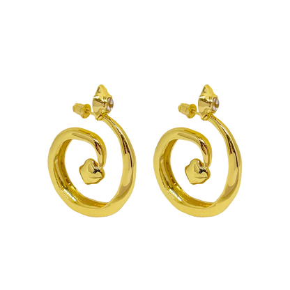 These beauties boast ethereal beauty and earthy grounding, the GAIA Earrings in Gold will have you feeling like a sophisticated goddess. Inspired by the beauty of natural stone and the&nbsp;fluidity of water, these chic hoop style earrings feature an elegant spiral motif that adds a chic touch to any look, and displaying faceted sparkling White CZ stones. A must-have for those who are looking to effortlessly standout.
