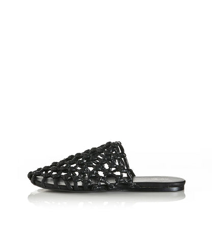 Effortless style meets modern edge with the Hezu slide. Designed with a handwoven lattice upper in sleek black, this slip-on brings a unique texture and elevated touch to everyday wear. The open-weave design keeps things light and breathable, while the minimalist silhouette ensures easy versatility—pair it with relaxed denim, summer dresses, or tailored pants for an instant style upgrade. Finished with a cushioned footbed and flat sole for all-day comfort, the Hezu is your go-to slide for a chic yet underst