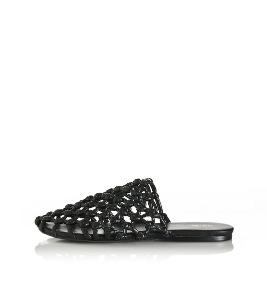 Effortless style meets modern edge with the Hezu slide. Designed with a handwoven lattice upper in sleek black, this slip-on brings a unique texture and elevated touch to everyday wear. The open-weave design keeps things light and breathable, while the minimalist silhouette ensures easy versatility—pair it with relaxed denim, summer dresses, or tailored pants for an instant style upgrade. Finished with a cushioned footbed and flat sole for all-day comfort, the Hezu is your go-to slide for a chic yet underst
