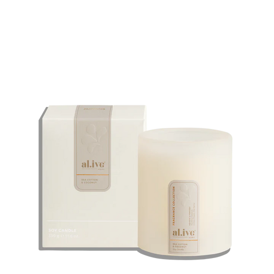 al.ive body - A calming Soy Candle blending powdery cotton flower with ocean air and delicate florals. Soft coconut and sandalwood create a serene atmosphere that evokes clean linens drying in a sea breeze.