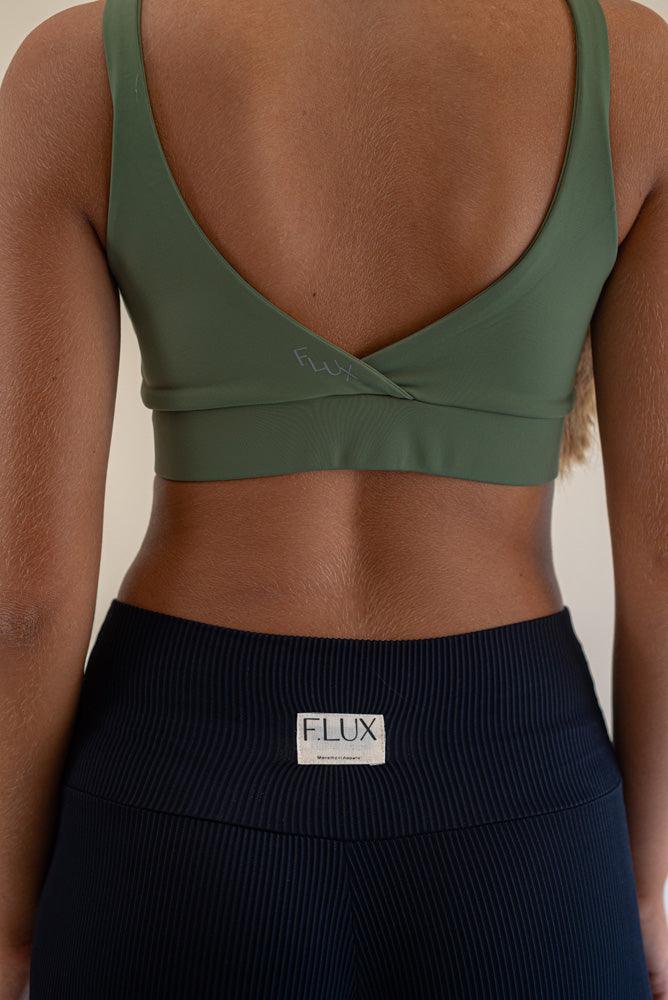 The bra's sexy V-back design will captivate you, while the crossover fabric with enclosed elastic at the front enhances this activewear masterpiece's versatility and comfort. High-quality stitching ensures durability, whether you're crushing your gym goals, perfecting your yoga poses, or rocking a casual street look, the Jungle Green Bruna Sports Bra is your trusted companion.
