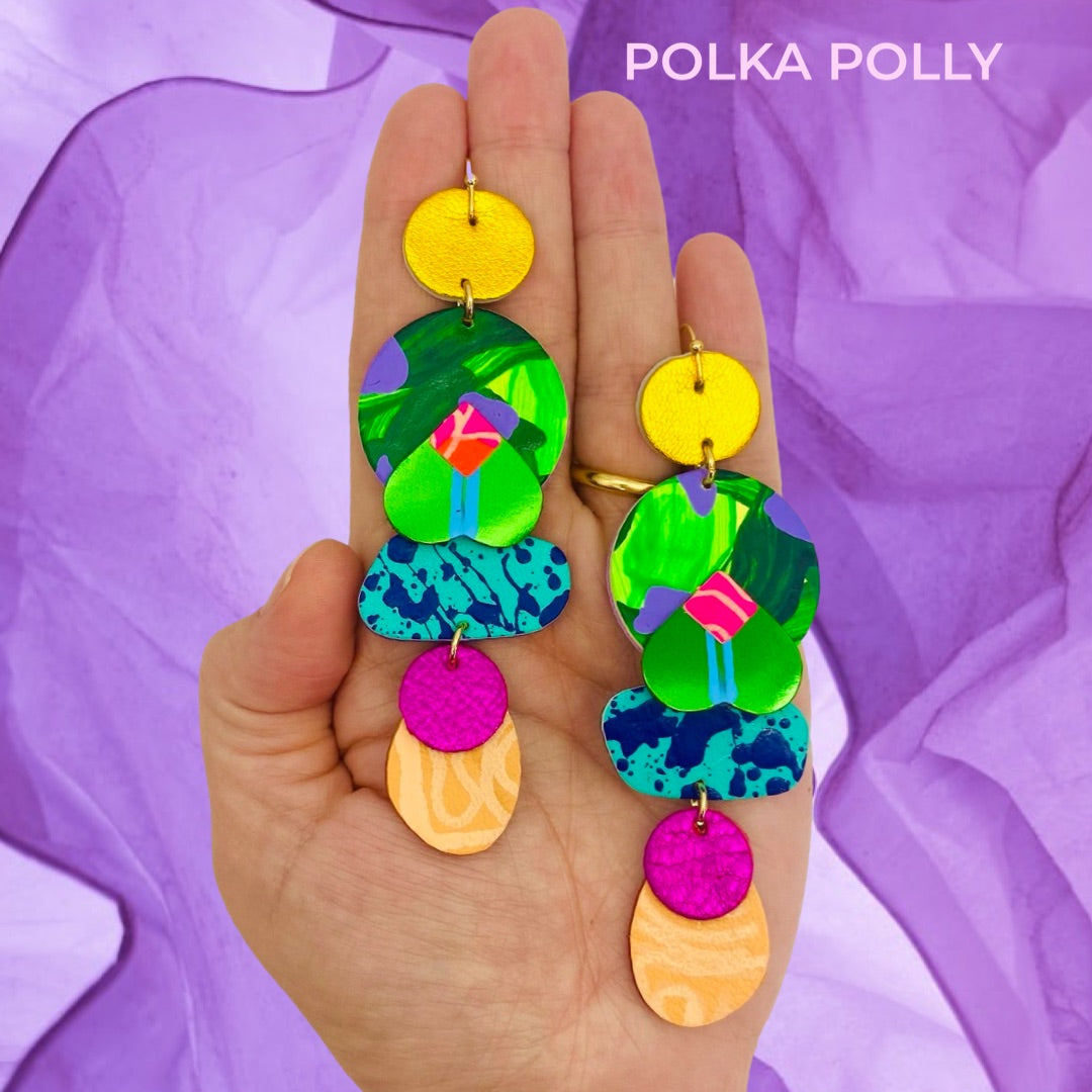 A striking pair of vibrant rainbow coloured handmade leather earrings by Polka Polly.