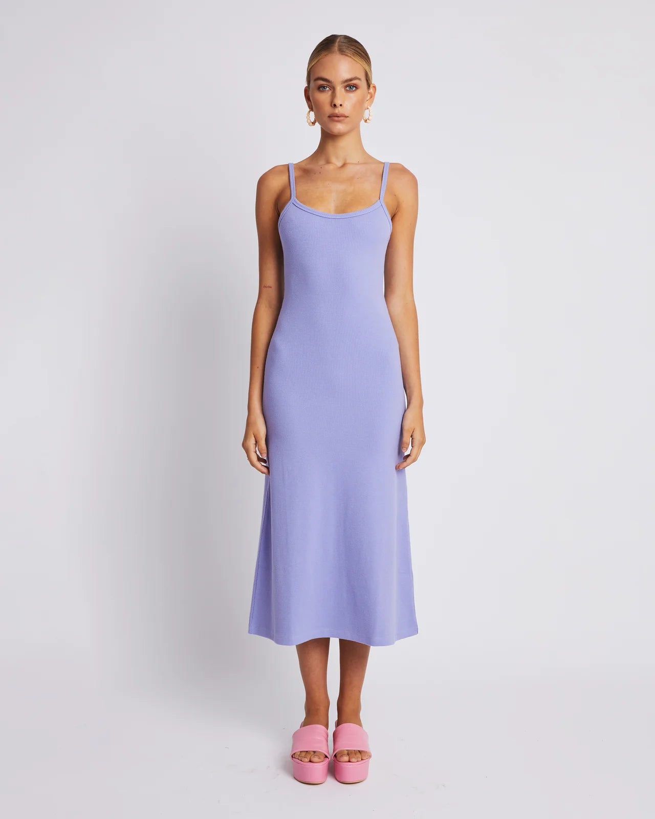 Look cool and feel comfortable in this A Line Midi Dress. With its thick ribbed cotton, it's form shaping, while keeping you comfortable. The midi length makes it perfect for any occasion. Get ready to look great in lilac.