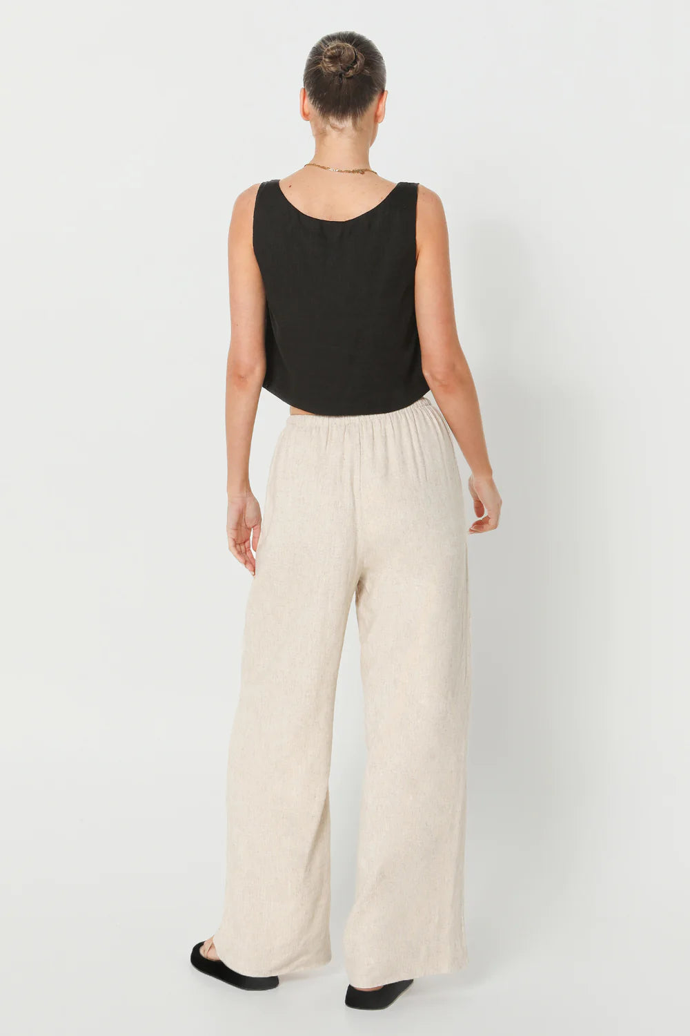 The Celeste Top Lost In Lunar in black is a relaxed fit top with a square neckline, thick straps, and a cropped length.
