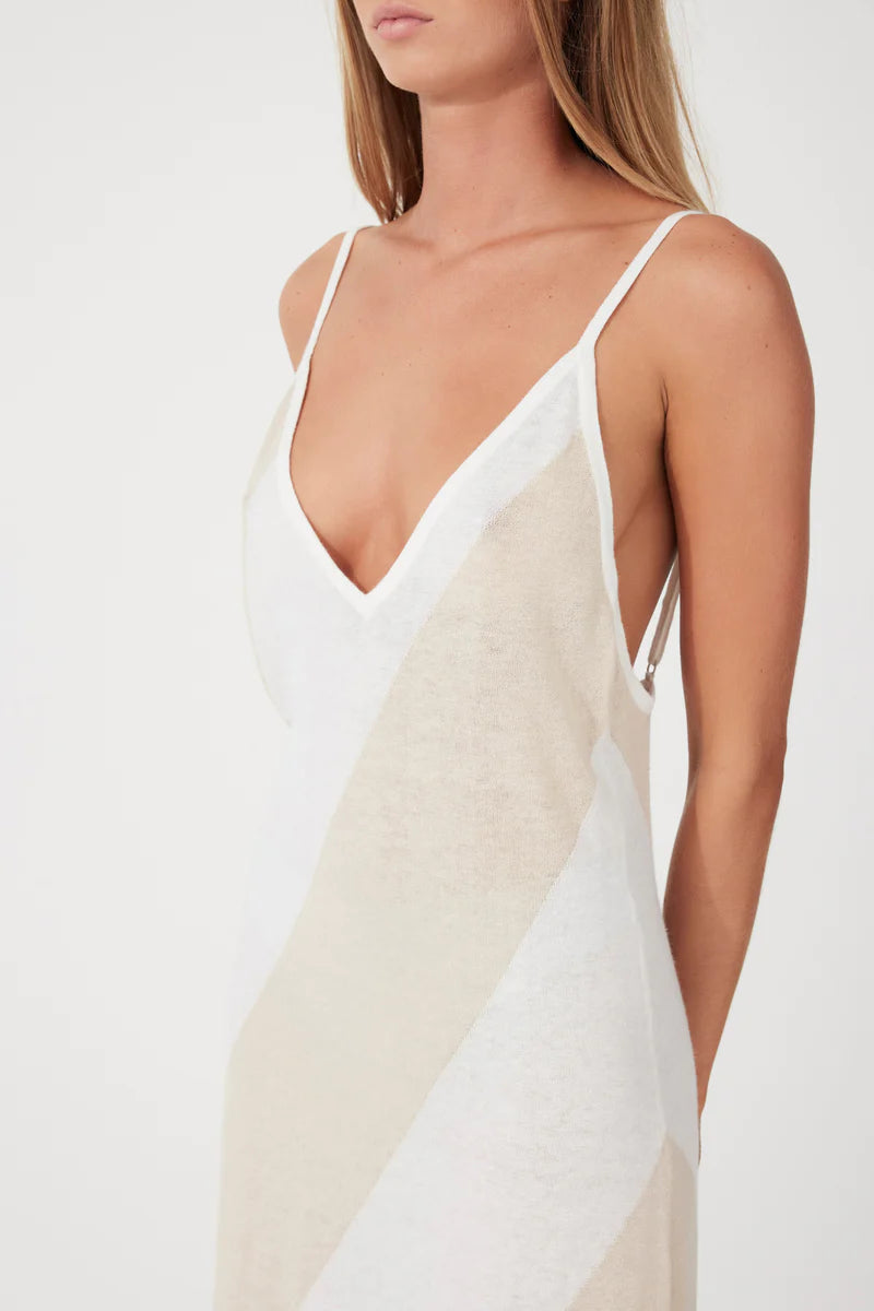 The Husk Stripe Knit Dress by Zulu & Zephyr features a V neckline, subtle A-line shape, and adjustable shoulder straps, in a soft, lightweight knit featuring a diagonal stripe in neutral tones.