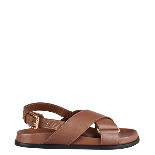 Effortlessly stylish, these footbed sandals simplify the process of dressing up. With a refined and adaptable smooth leather finish, they effortlessly complement any outfit in your wardrobe. The eye-catching crisscross buckle detail enhances the shoes, while the padded rounded-toe insole ensures a comfortable fit for all-day wear. 