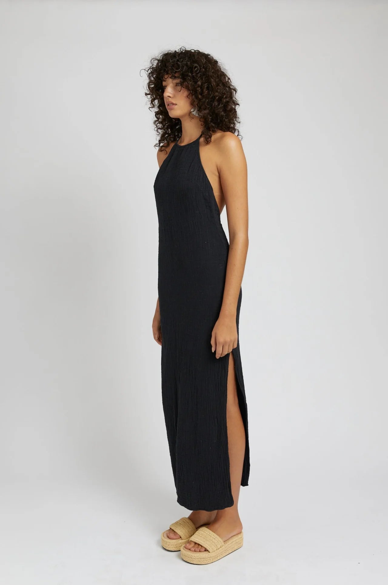 Get ready to turn heads in our Backless Halter Dress! Made from airy cotton gauze, this dress is perfect for those hot summer days. Show off your sultry side with its open back and halter neckline. Available in chic charcoal.