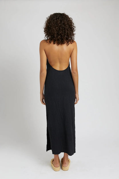 Get ready to turn heads in our Backless Halter Dress! Made from airy cotton gauze, this dress is perfect for those hot summer days. Show off your sultry side with its open back and halter neckline. Available in chic charcoal.