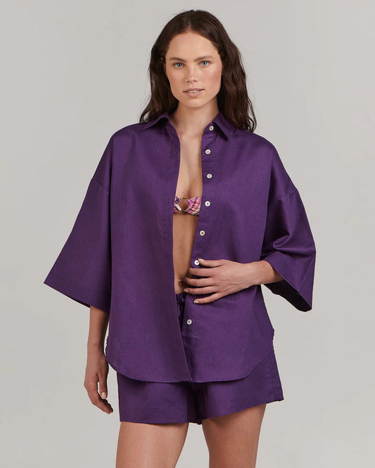In a relaxed oversized cut and saturated purple hue, this lovely pure cotton shirt is equal parts comfort and elegance. Wear with the coordinating Harlow lounge short and white kicks for a chic vacation ensemble.