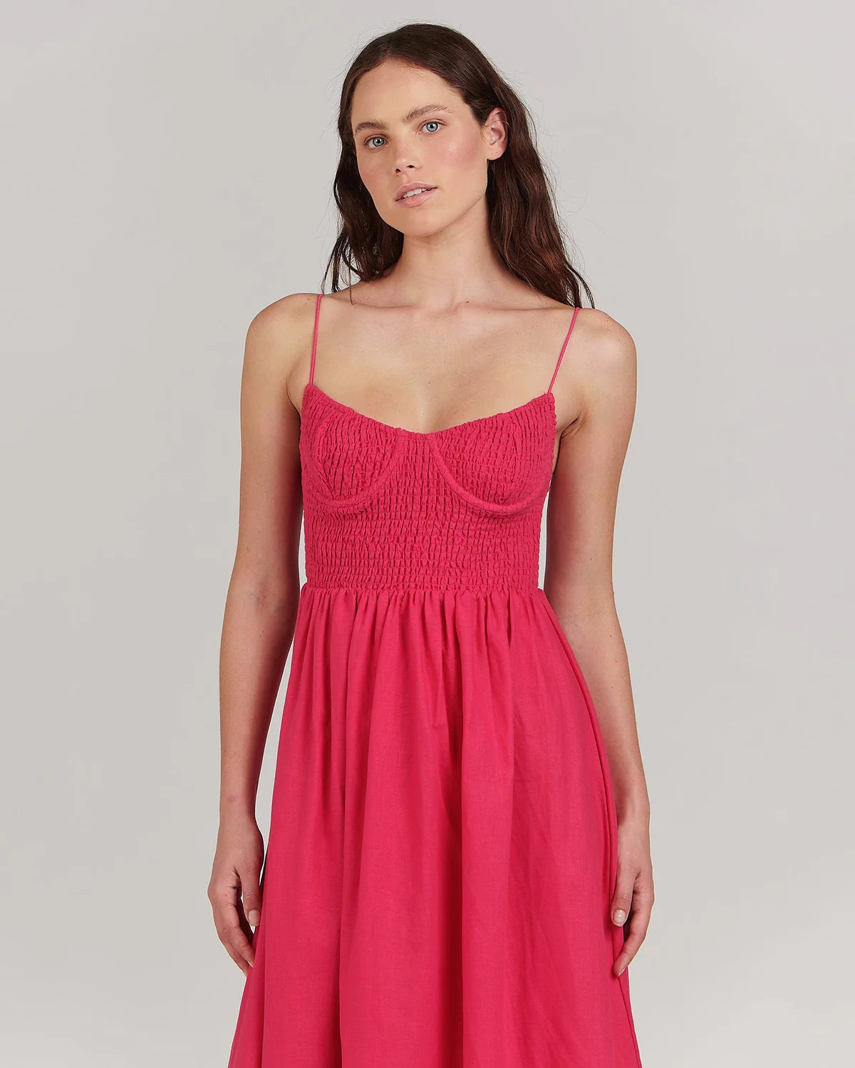 With its fitted bodice and gathered skirt, this linen-blend maxi dress by Charlie Holiday is a beauty in eye-catching fuchsia. Dress it up for cocktails with sky-high heels and a cute clutch.