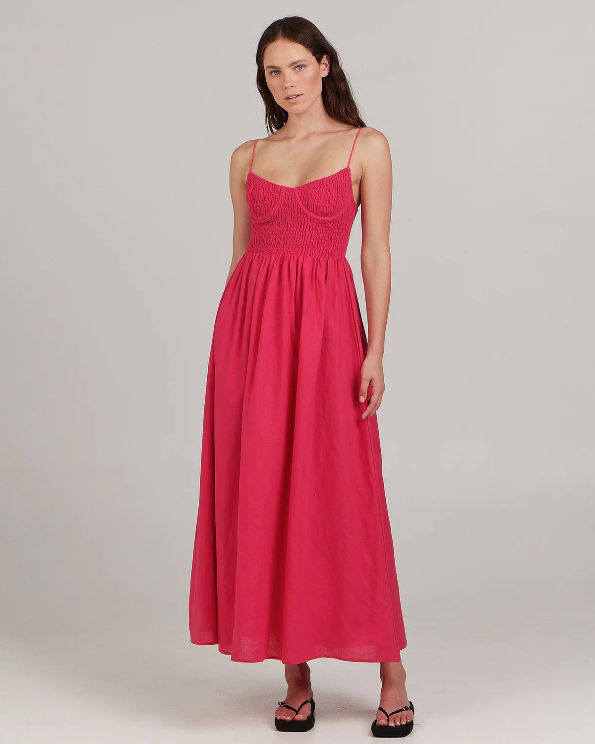 With its fitted bodice and gathered skirt, this linen-blend maxi dress by Charlie Holiday is a beauty in eye-catching fuchsia. Dress it up for cocktails with sky-high heels and a cute clutch.