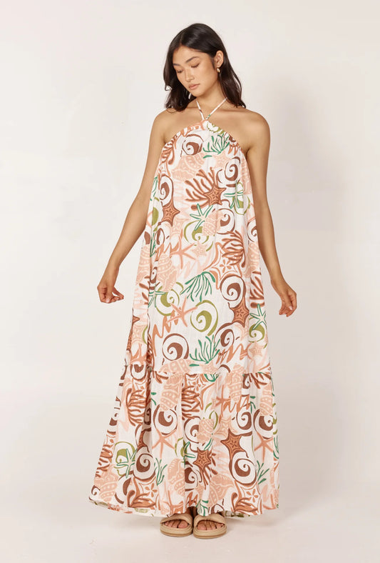 The Tessa Maxi Dress in our exclusive Koralli Print exudes elegance with its halter tie up and stunning open back design. This floaty maxi dress is a must-have for any special occasion.
