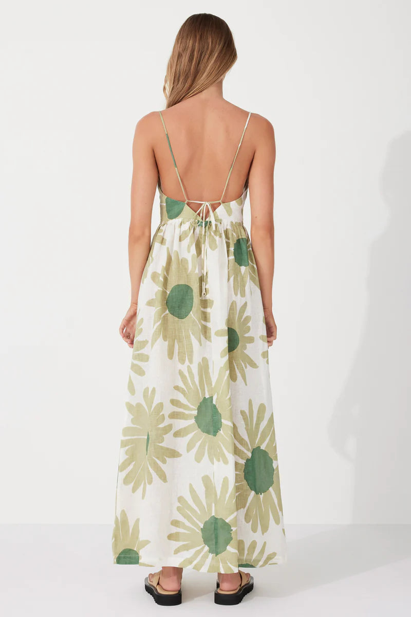 The Aloe Flower Linen Dress by Zulu & Zephyr is a beautiful feminine style featuring a full-length floaty skirt, bust tie detail, and thin shoulder straps which feed through to the back to tie offering an optimum fit, in a lightweight fabrication featuring a custom floral screen print